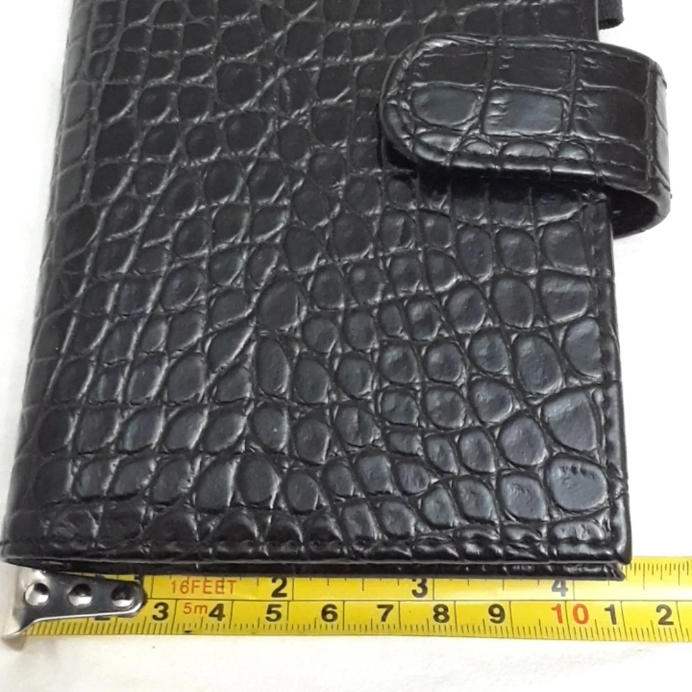 Black 6 ring planner 6.5 x 10.5 Faux leather snake style pattern. New.